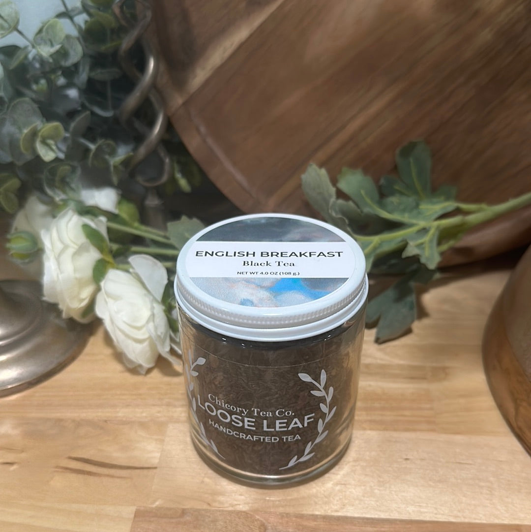 An artistic product photo of Chicory Tea Co.'s English Breakfast Black Tea in the jar, view from the front