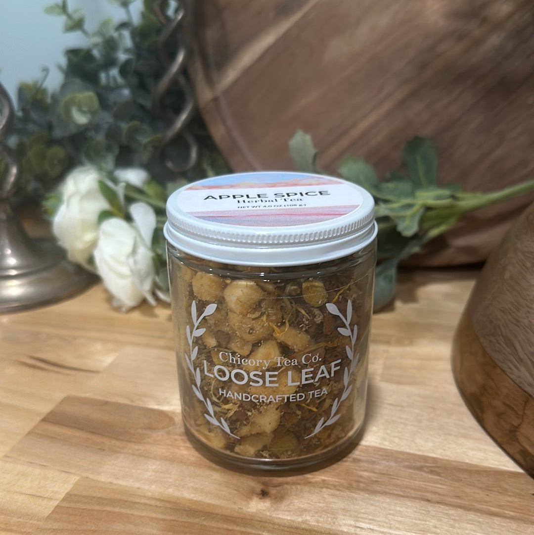An artistic product photo of Chicory Tea Co.'s Apple Spice Herbal Tea in the jar, view from front