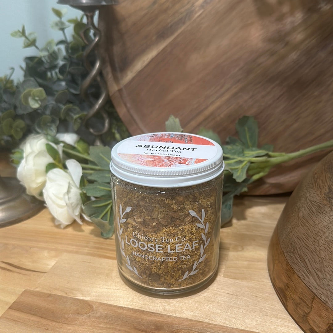 An artistic product photo of Chicory Tea Co.'s Abundant Herbal Tea in the jar, view from front