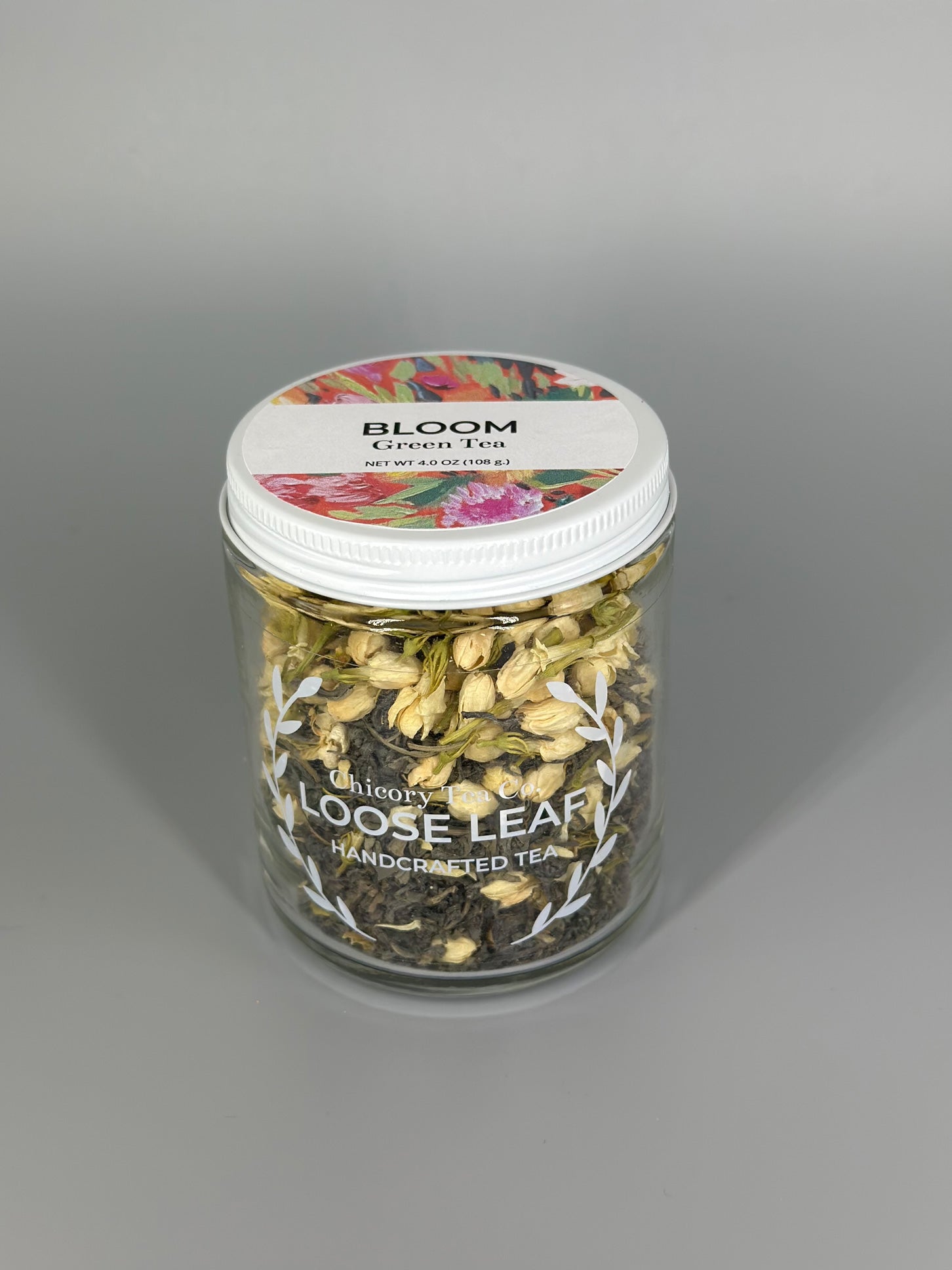 Chicory Tea Co.'s Bloom Green Tea in the jar, view from front