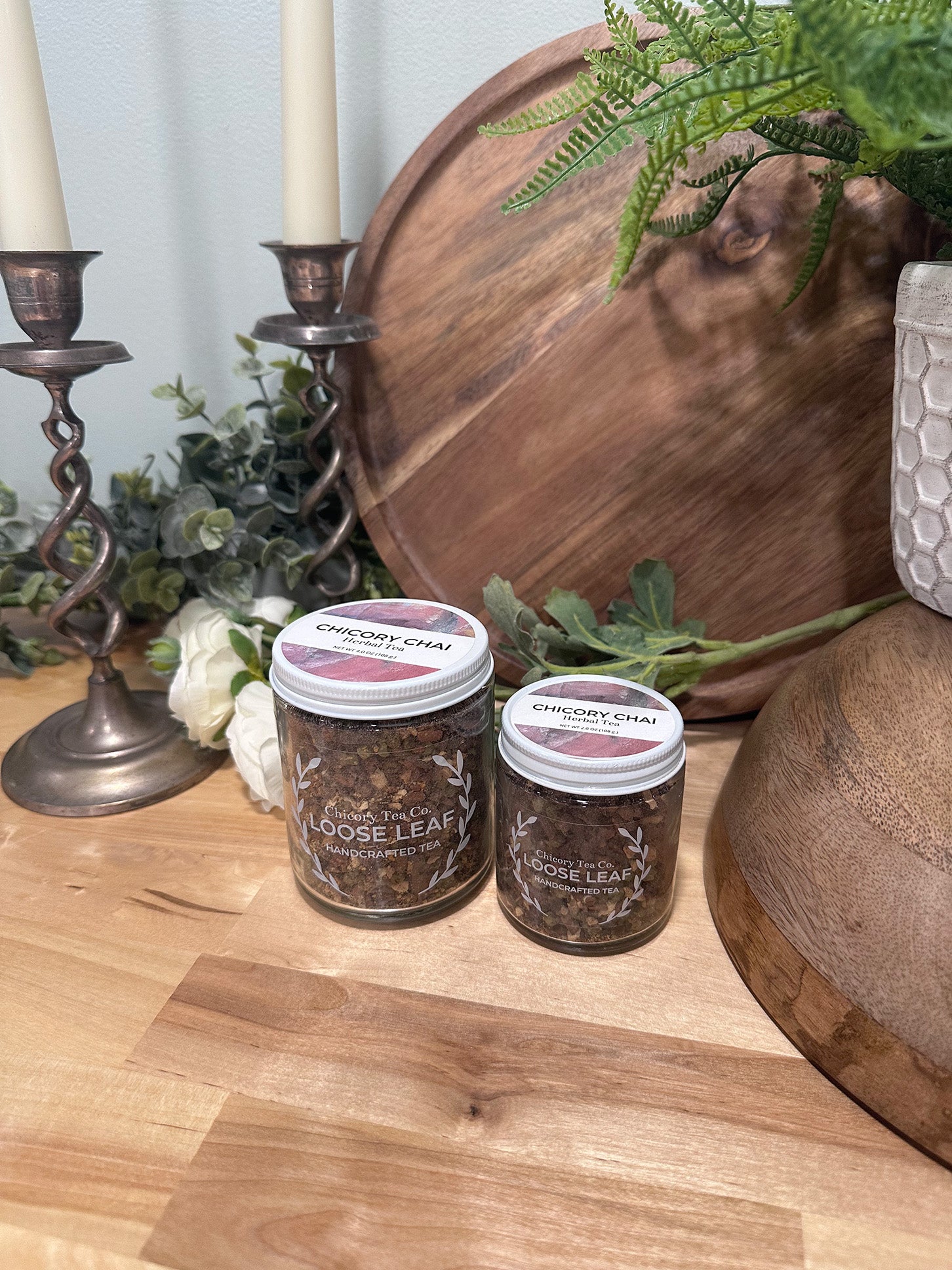 Chicory Tea Co.'s Chicory Chai Herbal Tea in small and large jars, view from the front