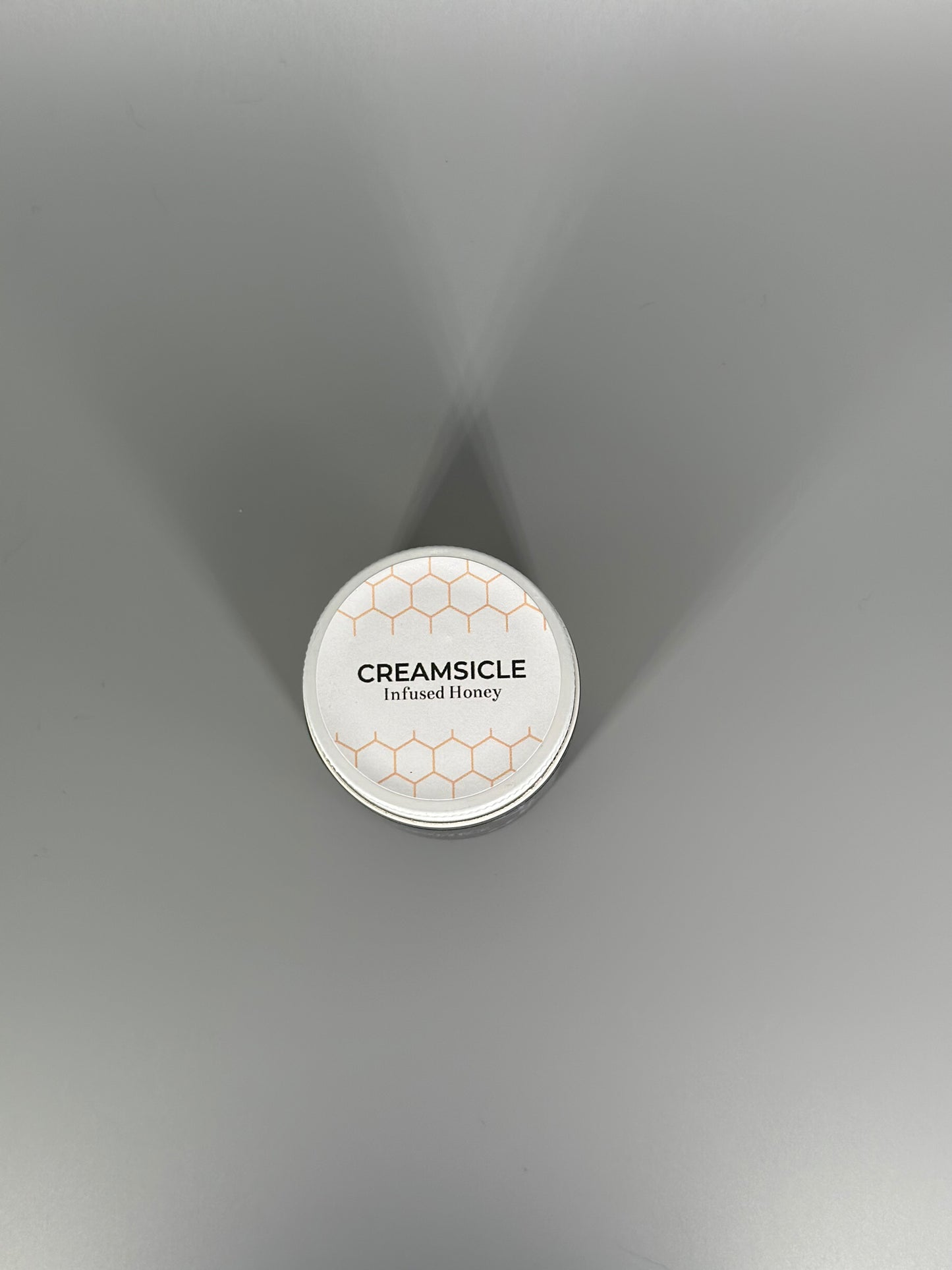 Chicory Tea Co.'s Creamsicle Honey in the jar, view from the top