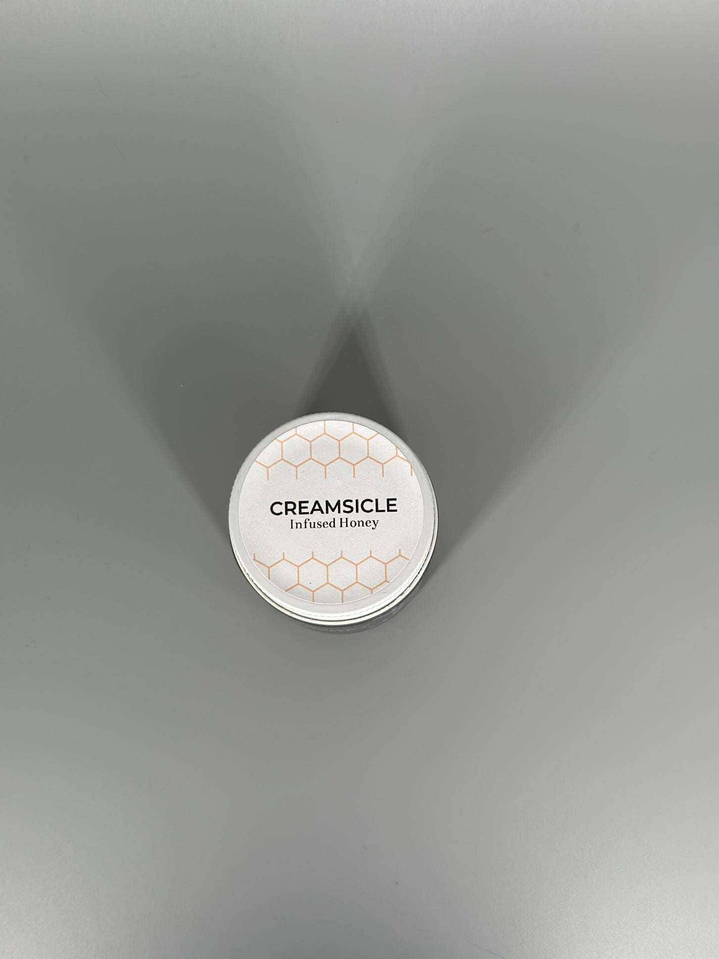 Chicory Tea Co.'s Creamsicle Honey in the jar, view from the top