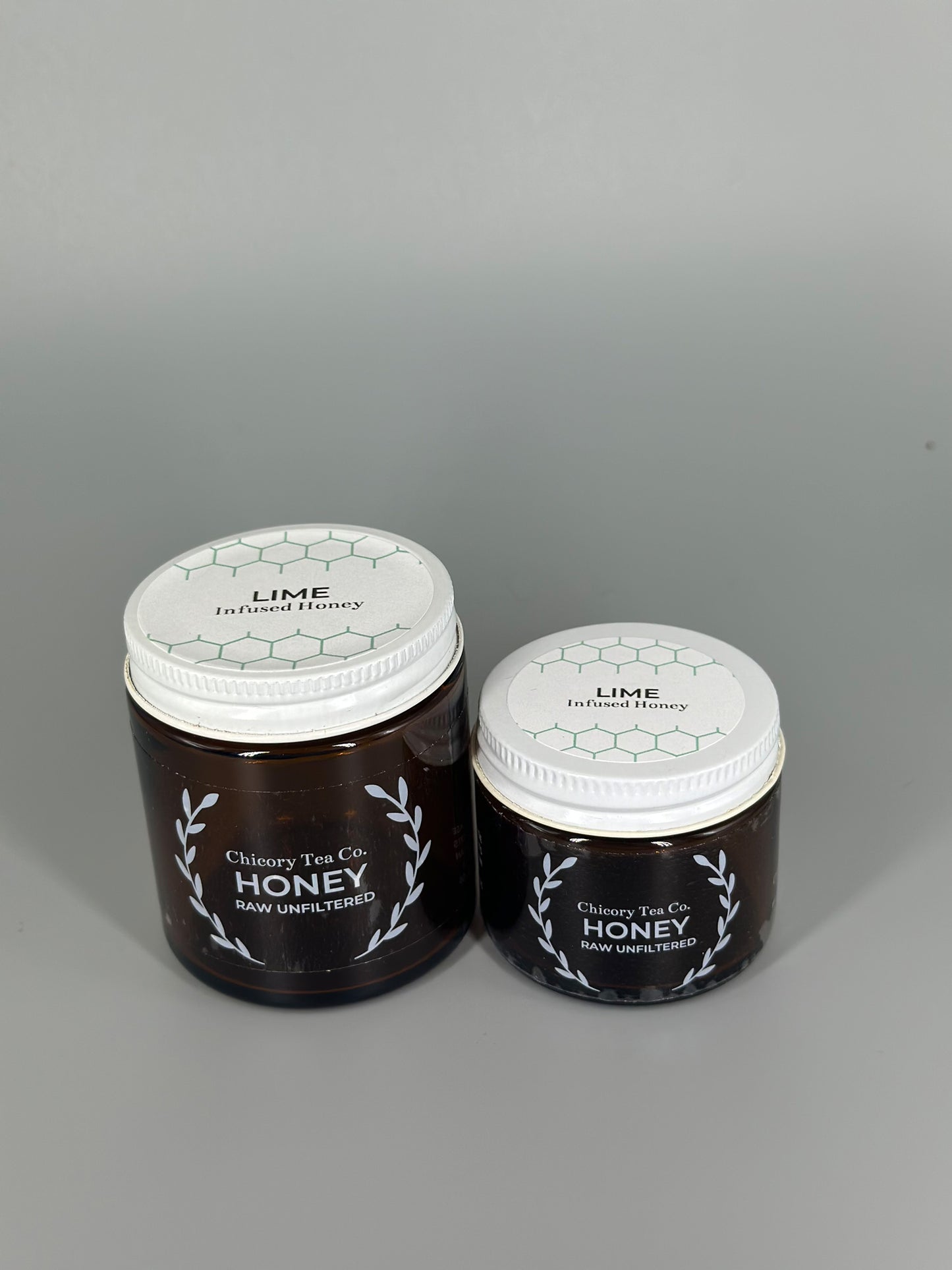 Chicory Tea Co.'s Lime Honey 2oz and 4oz in jars, view from front