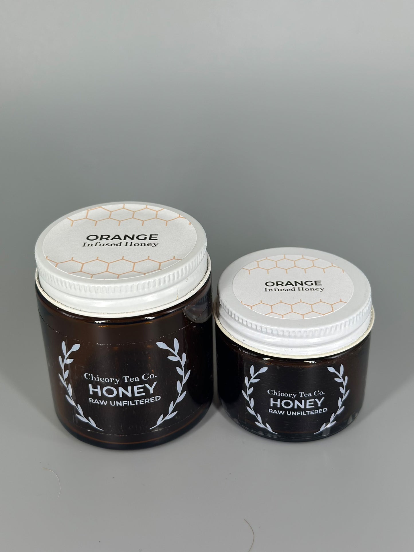 Chicory Tea Co'.s Small and Large Orange Honey view from front