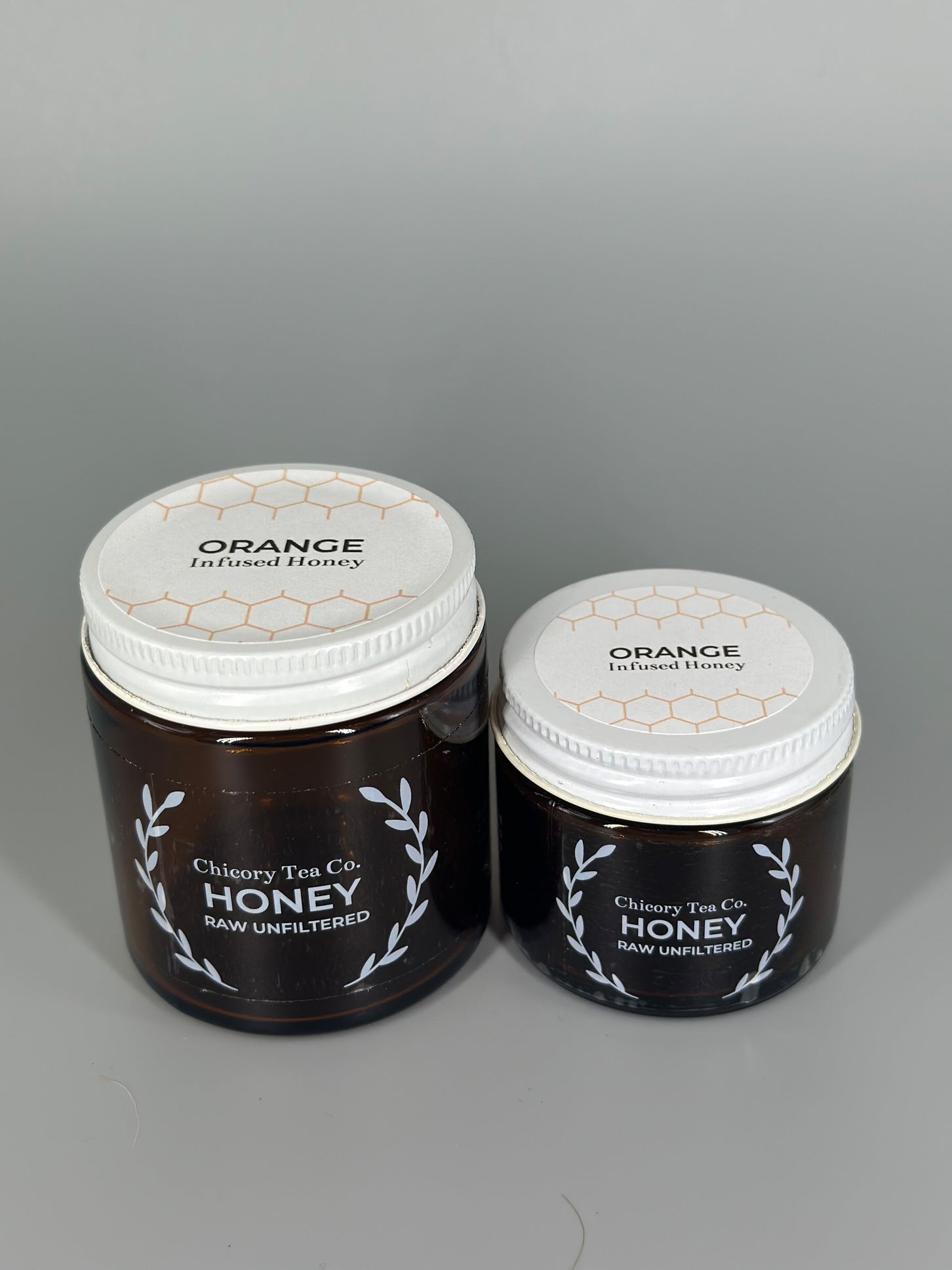 Chicory Tea Co'.s Small and Large Orange Honey view from front