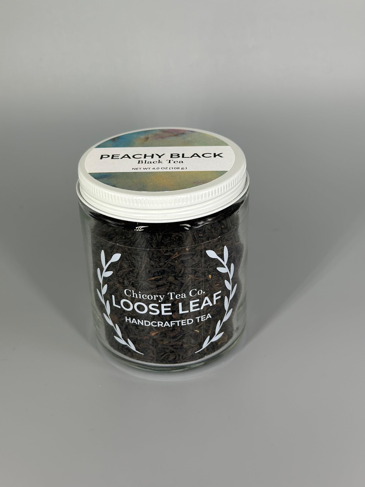 Chicroy Tea Co.'s Peachy Black Tea in the jar, view from front