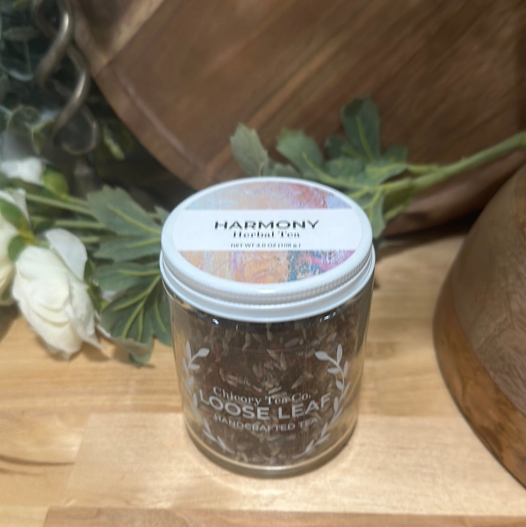 An artistic product photo of Chicory Tea Co.'s Harmony Herbal Tea in the jar, view from the front