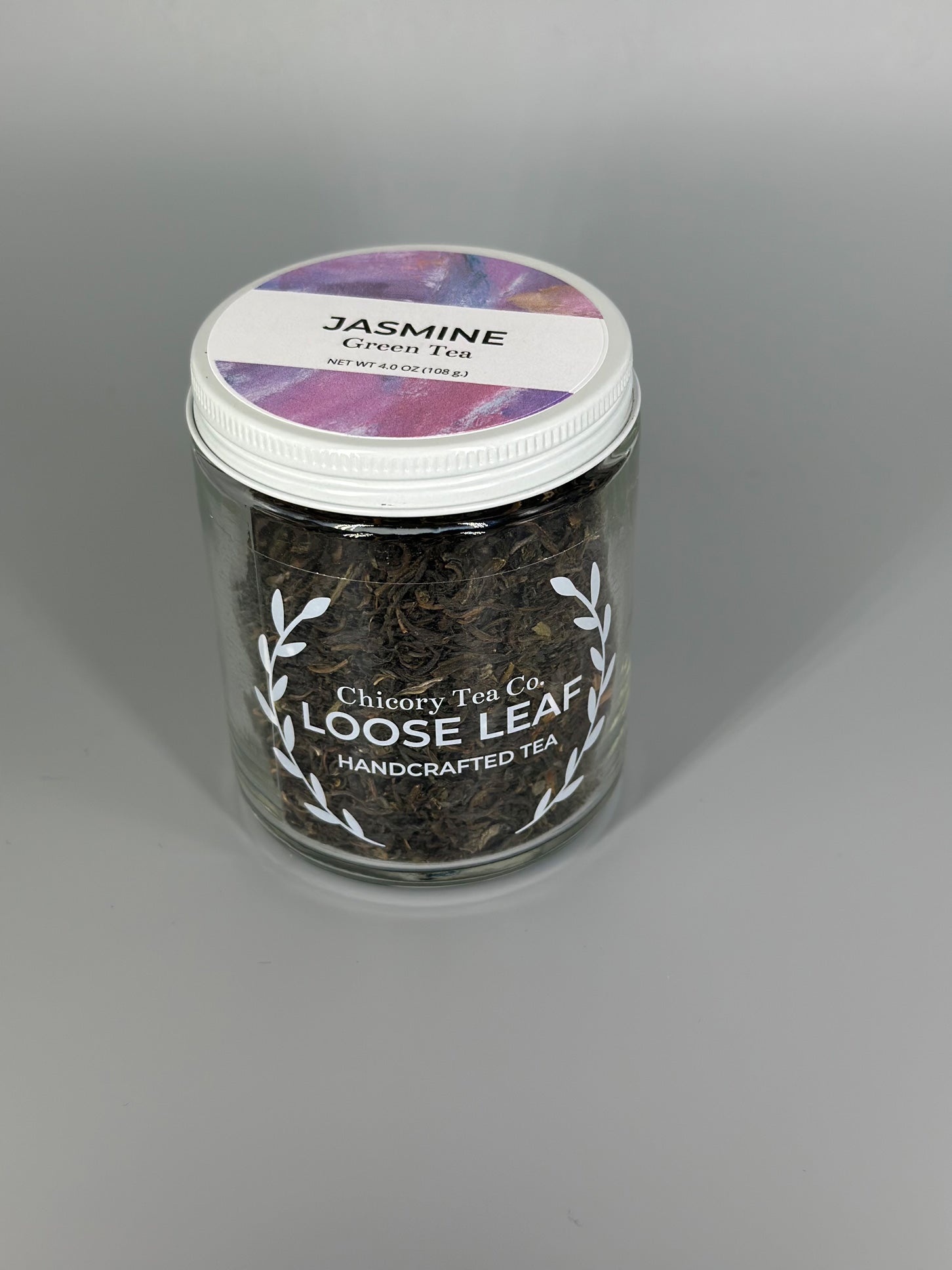 Chicory Tea Co.'s Jasmine Green Tea in the jar, from the front