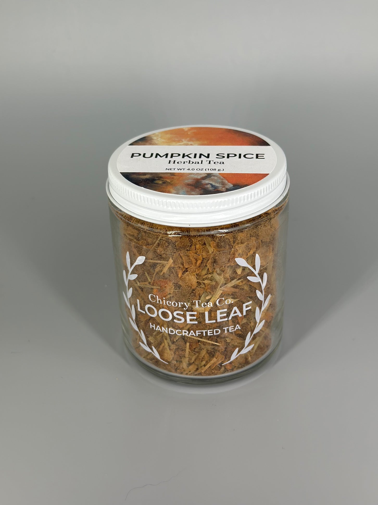 Chicory Tea Co.'s Pumpkin Spice Herbal Tea in the jar, view from front