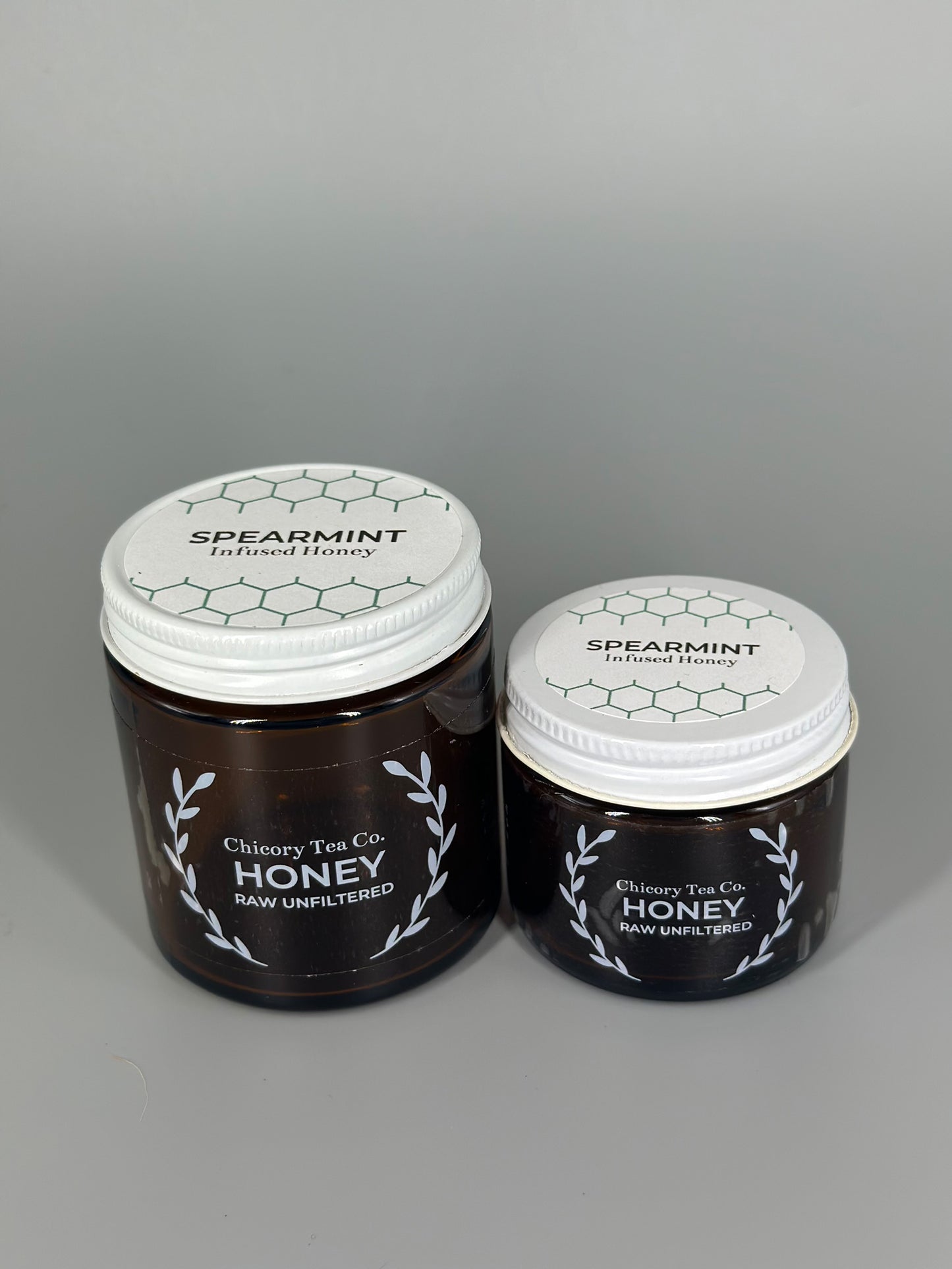 Chicory Tea Co.'s Spearmint Honey in small and large jar, view from front